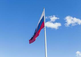 Close up shot of the Russian flag floating on the wind. Country photo