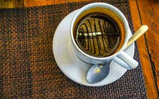 Cup of americano black coffee in restaurant cafe in Mexico. photo