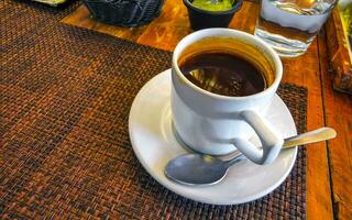 Cup of americano black coffee in restaurant cafe in Mexico. photo