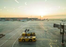 Ran way of the large international airport during sunrise. Aviation photo