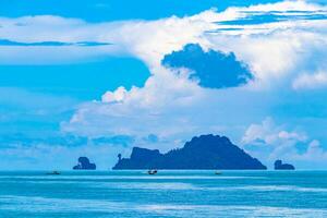 Tropical paradise turquoise water beach and limestone rocks Krabi Thailand. photo