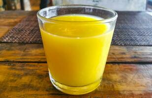 Orange fruit juice in restaurant PapaCharly Playa del Carmen Mexico. photo