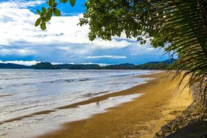 Tropical paradise turquoise water beach and limestone rocks Krabi Thailand. photo