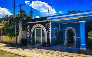 Tulum Quintan Roo Mexico 2023 Typical colorful street road traffic cars palms of Tulum Mexico. photo