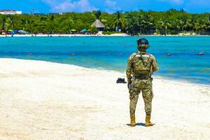 Playa del Carmen Quintana Roo Mexico 2023 Military National Guard patrols monitors beach Playa del Carmen Mexico. photo