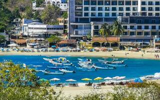 Puerto Escondido Oaxaca Mexico 2023 Fishing boats at the harbor beach in Puerto Escondido Mexico. photo