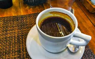 Cup of americano black coffee in restaurant cafe in Mexico. photo