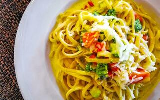 White plate of tasty pasta noodles meal dish food Mexico. photo