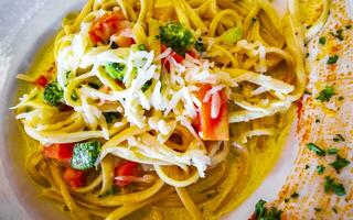 White plate of tasty pasta noodles meal dish food Mexico. photo