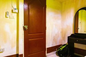 Ao Nang Krabi Thailand 2018 Brown door in an old hotel room Koh Phi Phi. photo