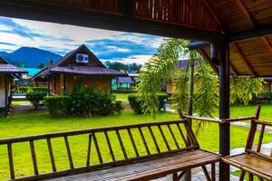 Wooden bamboo cottages in natural tropical jungle resort Krabi Thailand. photo