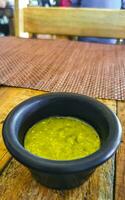 Spicy green Mexican coriander sauce cilantro Playa del Carmen Mexico. photo