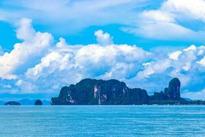 Tropical paradise turquoise water beach and limestone rocks Krabi Thailand. photo