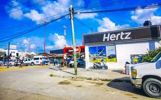 Tulum Quintan Roo Mexico 2023 Typical colorful street road traffic cars palms of Tulum Mexico. photo