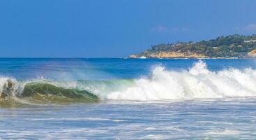 Extremely huge big surfer waves at beach Puerto Escondido Mexico. photo