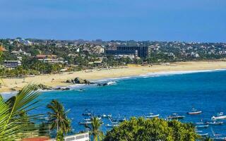 Sun beach sand surfer waves palms in Puerto Escondido Mexico. photo