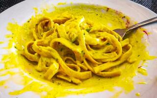 White plate of tasty pasta noodles meal dish food Mexico. photo