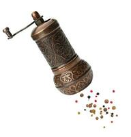 Copper hand mill for pepper and salt isolated on white background photo