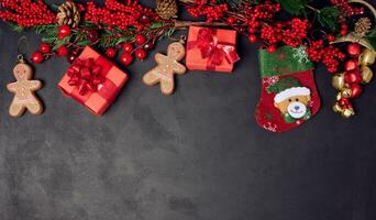 Christmas decor, gift red boxes on a black background, top view. photo