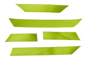 Pieces of green satin ribbon on isolated background, set photo