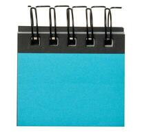 Notepad with blue blank sheets on white isolated background photo