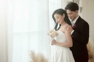 Couple of bride and groom enjoying romantic moments in wedding ceremony, Love, celebration and marriage. photo