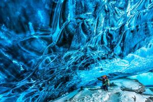 Traveler in the ice cave photo