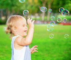 Happy child playing outdoors photo