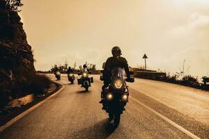 Bikers on Sunset in the Mountains photo