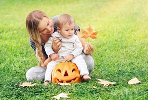 Happy mother with son celebrates Halloween photo