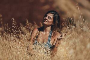 Calm Female on Wheat Field photo