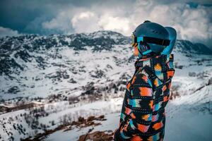 Snowboarder Woman looking far photo