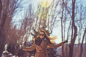 Pretty girl enjoys winter photo