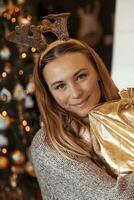 Cheerful woman received Christmas gift photo