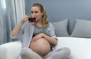 Happy Pregnant Woman at Home photo