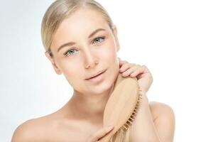 Beautiful woman combing her hair photo