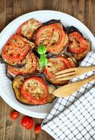 Baked eggplant with tomatoes photo