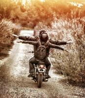 Riding on motorbike with pleasure photo