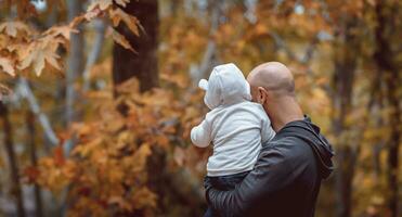 Happy family in the autumn forest photo