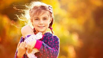 Sweet baby girl with doll photo