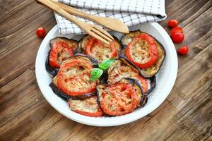 Baked eggplant with tomatoes photo