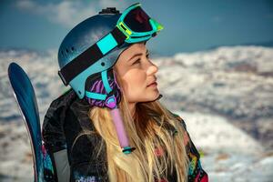 Sportswoman with snowboard photo