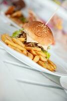 Big tasty burger with french fries photo