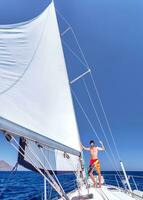 Cheerful man on sailboat photo