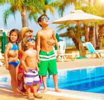 Happy family near pool photo