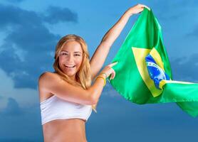 Happy fan of Brazilian football team photo