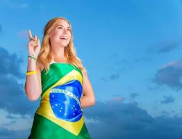 Happy fan of Brazilian football team photo