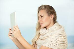 Beautiful student girl with tablet photo