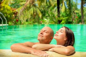 Romantic couple in a pool photo