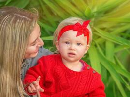 Mother with baby in the park photo